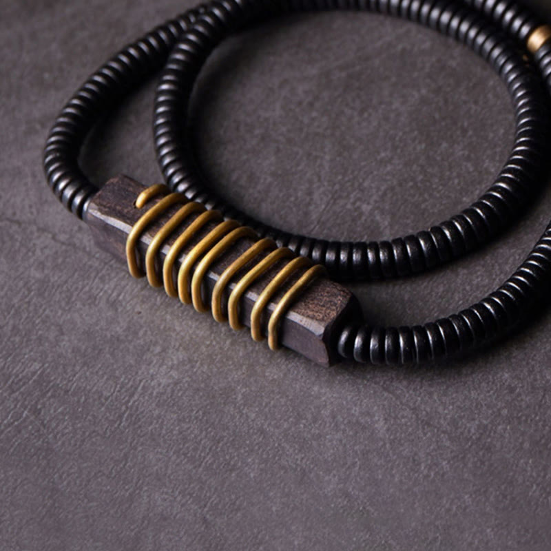 Collana con bracciale a doppio giro in Buddha Stones, in legno di ebano, in ottone e rame, con sfera di equilibrio cubica