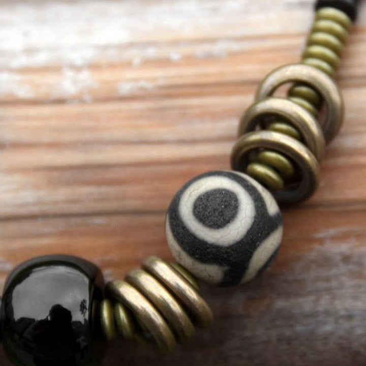 Buddha Stones Legno di ebano Sandalo verde Rame Ottone Perline Dzi Onice nero Braccialetto doppio giro calmo