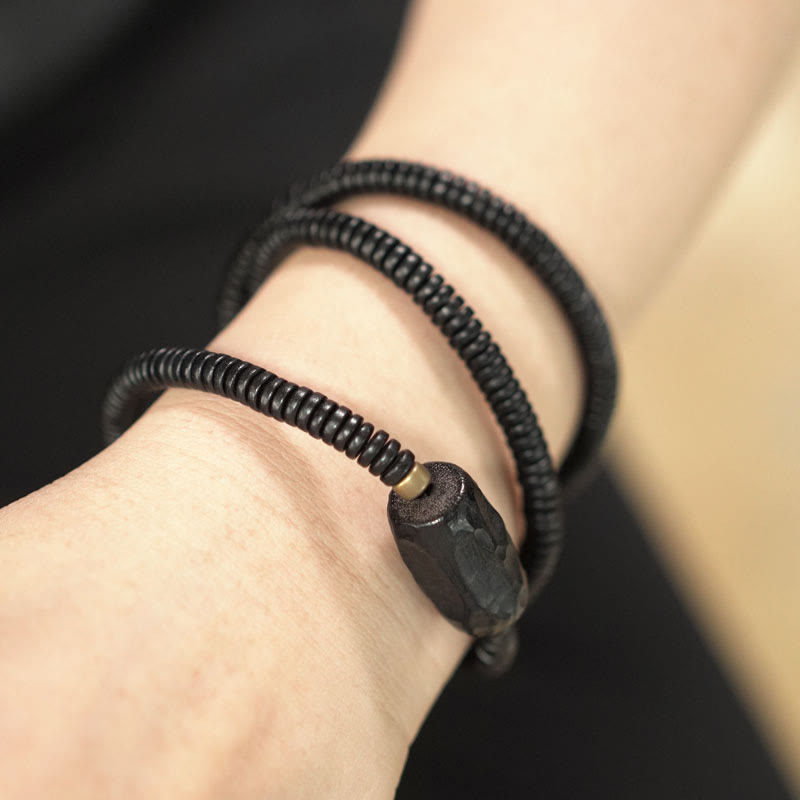 Braccialetto triplo giro in ottone e rame in legno di ebano Buddha Stones