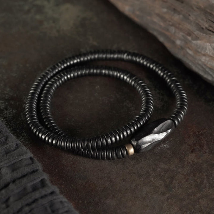 Braccialetto triplo giro in ottone e rame in legno di ebano Buddha Stones