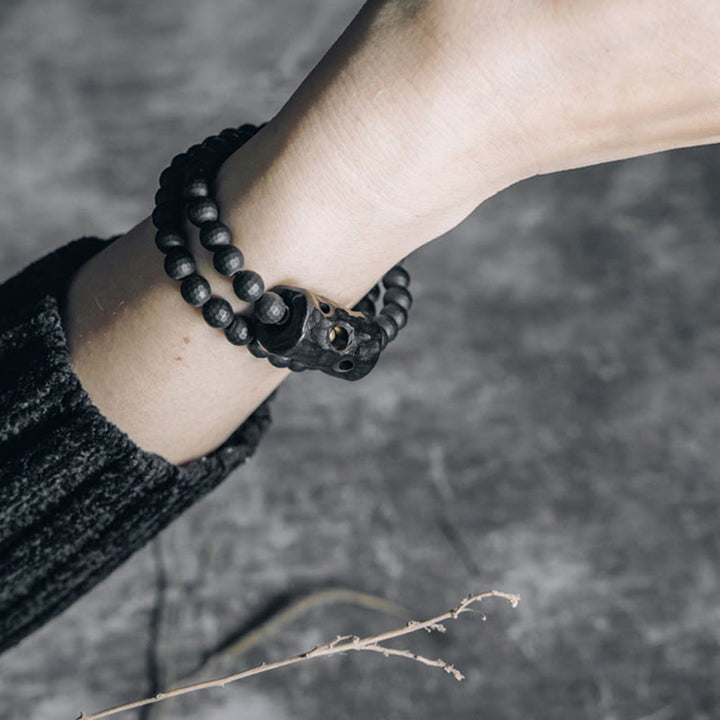 Braccialetto di protezione a doppio giro in onice nero ebano con superficie tagliata smerigliata Buddha Stones