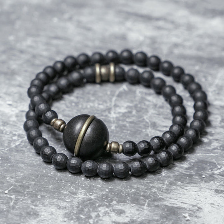 Braccialetto di protezione a doppio giro con perline di ebano e onice nero con superficie tagliata smerigliata Buddha Stones