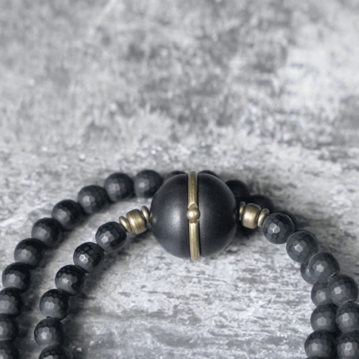 Braccialetto di protezione a doppio giro con perline di ebano e onice nero con superficie tagliata smerigliata Buddha Stones
