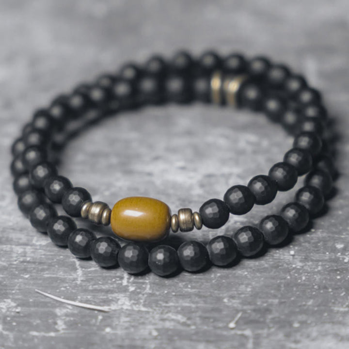 Braccialetto di protezione a doppio giro con perline di onice nero e topazio con superficie tagliata smerigliata Buddha Stones