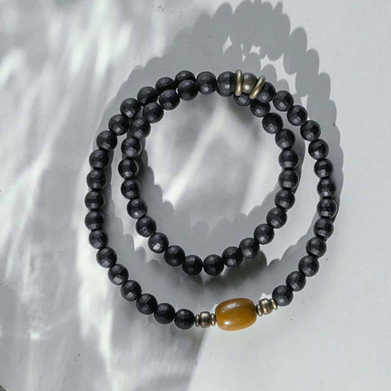 Braccialetto di protezione a doppio giro con perline di onice nero e topazio con superficie tagliata smerigliata Buddha Stones