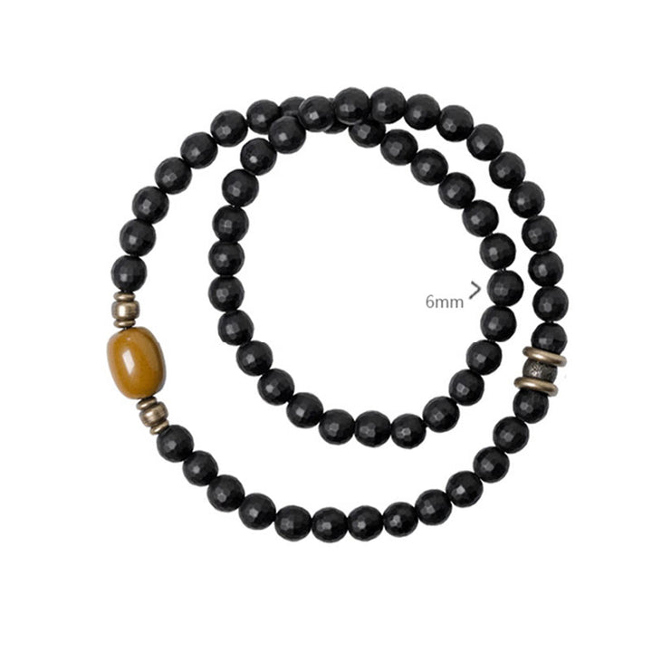 Braccialetto di protezione a doppio giro con perline di onice nero e topazio con superficie tagliata smerigliata Buddha Stones