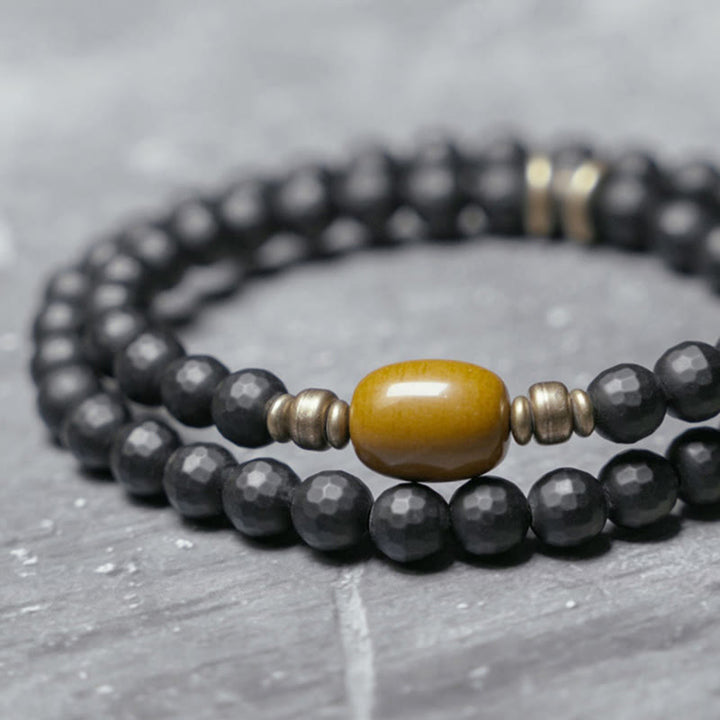 Braccialetto di protezione a doppio giro con perline di onice nero e topazio con superficie tagliata smerigliata Buddha Stones