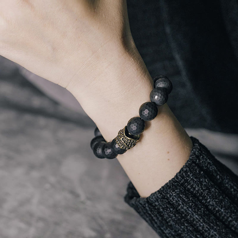 Braccialetto di protezione in ottone e rame con onice nero opaco Buddha Stones