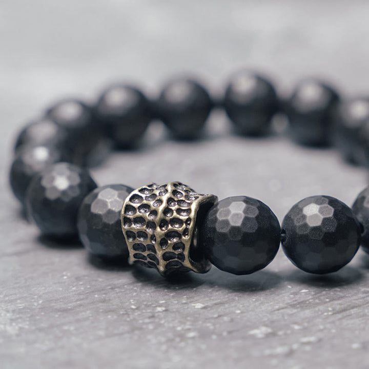 Braccialetto di protezione in ottone e rame con onice nero opaco Buddha Stones