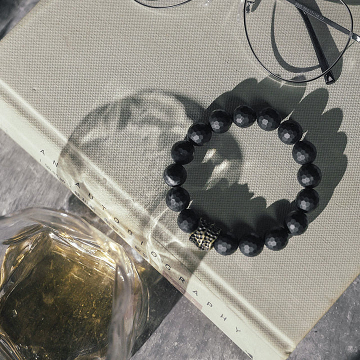 Braccialetto di protezione in ottone e rame con onice nero opaco Buddha Stones