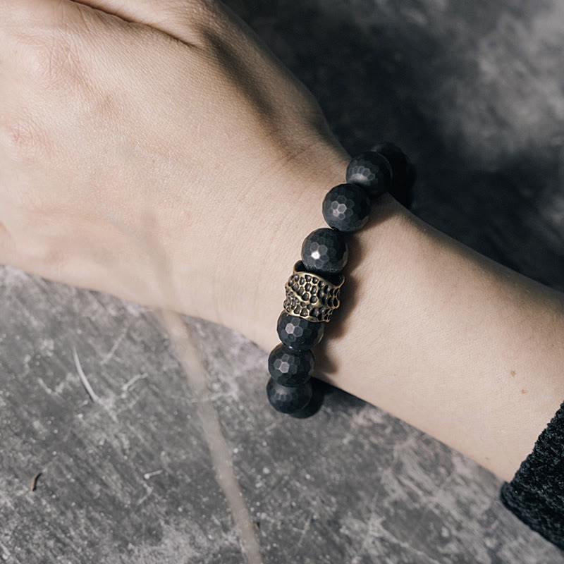 Braccialetto di protezione in ottone e rame con onice nero opaco Buddha Stones