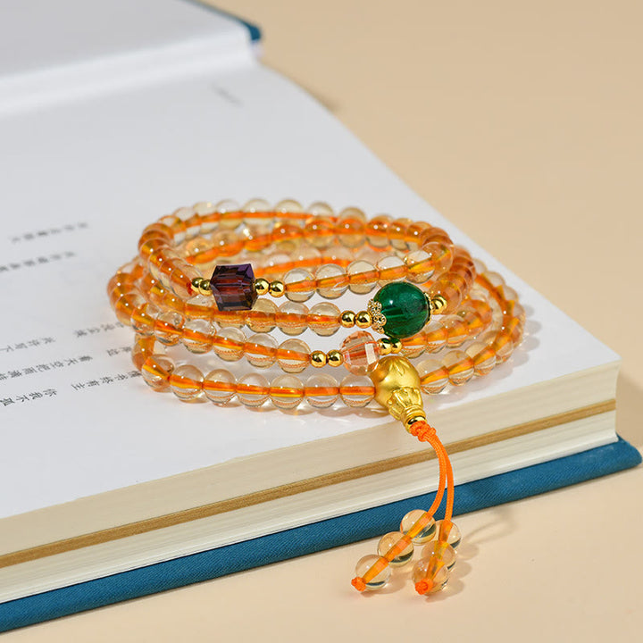 Braccialetto della felicità con 108 perle di Mala in citrino Buddha Stones