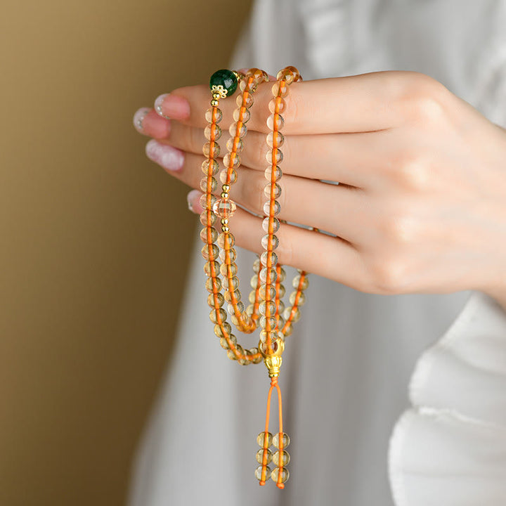 Braccialetto della felicità con 108 perle di Mala in citrino Buddha Stones