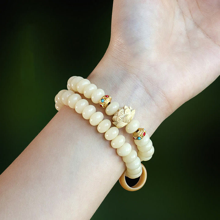 Braccialetto doppio giro Buddha Stones Bodhi Seed Peach Wood Lotus Wealth