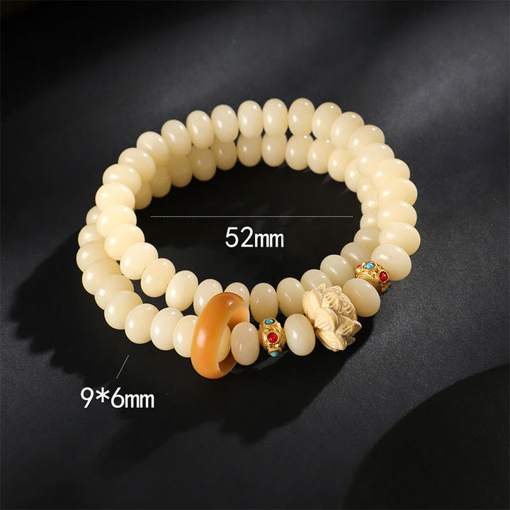 Braccialetto doppio giro Buddha Stones Bodhi Seed Peach Wood Lotus Wealth