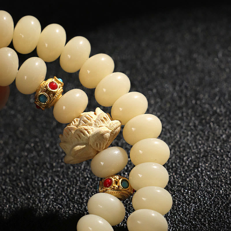 Braccialetto doppio giro Buddha Stones Bodhi Seed Peach Wood Lotus Wealth