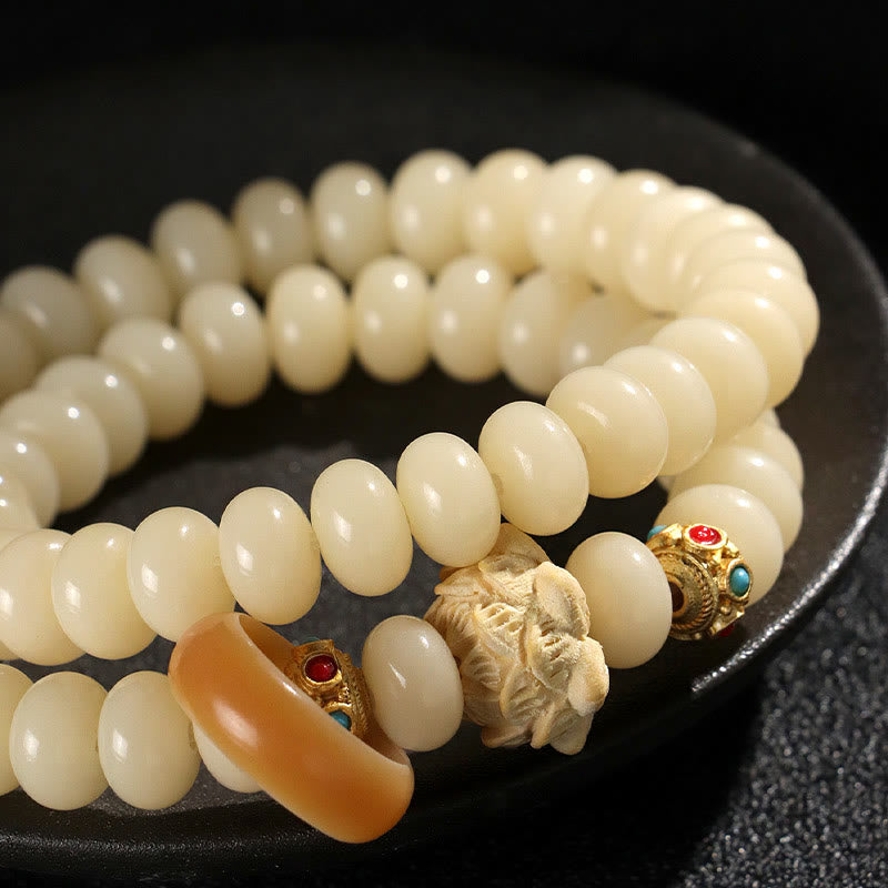 Braccialetto doppio giro Buddha Stones Bodhi Seed Peach Wood Lotus Wealth