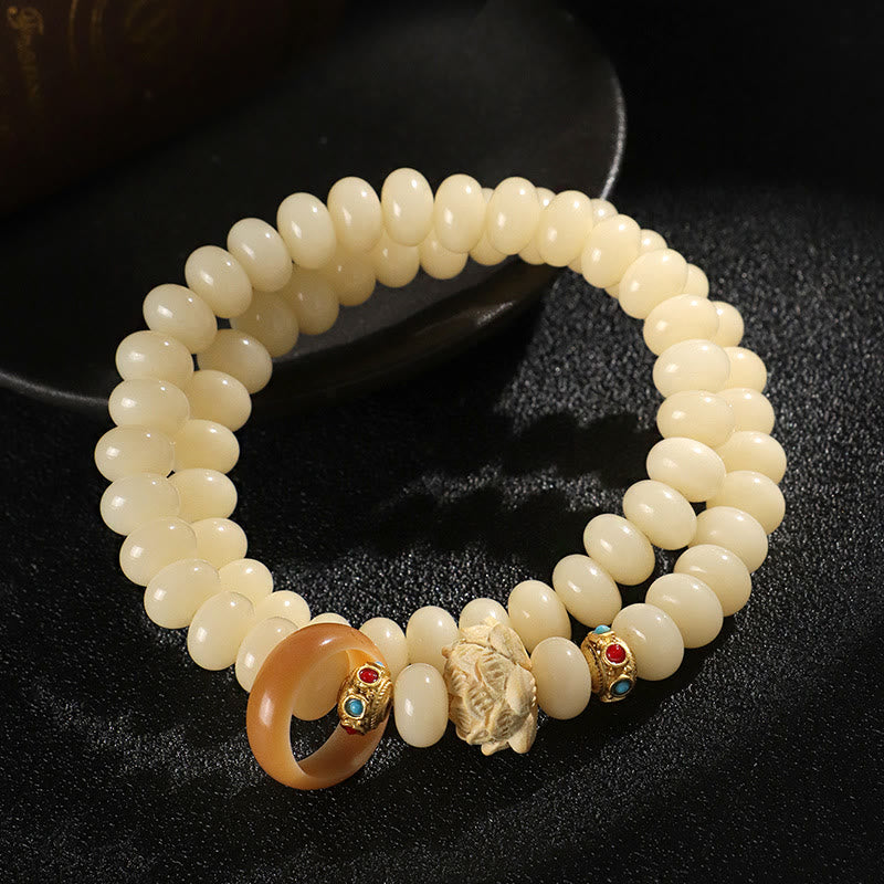 Braccialetto doppio giro Buddha Stones Bodhi Seed Peach Wood Lotus Wealth