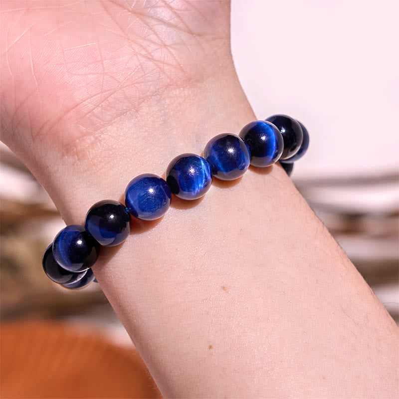 Braccialetto di equilibrio con occhio di tigre blu Buddha Stones