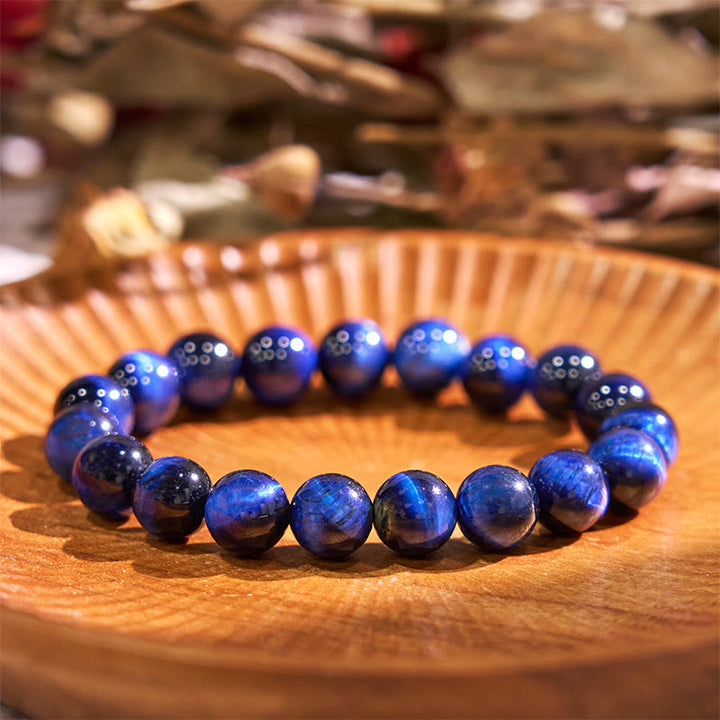 Braccialetto di equilibrio con occhio di tigre blu Buddha Stones