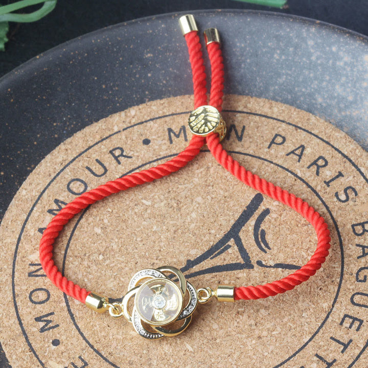 Buddha Stones Rotanti Prugna Rosso Corda Rame Ottone Mulino a Vento Feng Sheng Shui Qi Protezione Bracciale Intrecciato