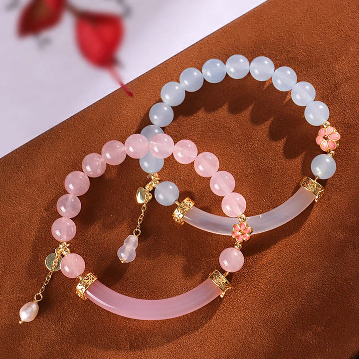 Braccialetto a metà polsino in perle di calcedonio blu e cristallo rosa Buddha Stones