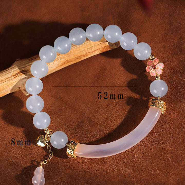Braccialetto a metà polsino in perle di calcedonio blu e cristallo rosa Buddha Stones