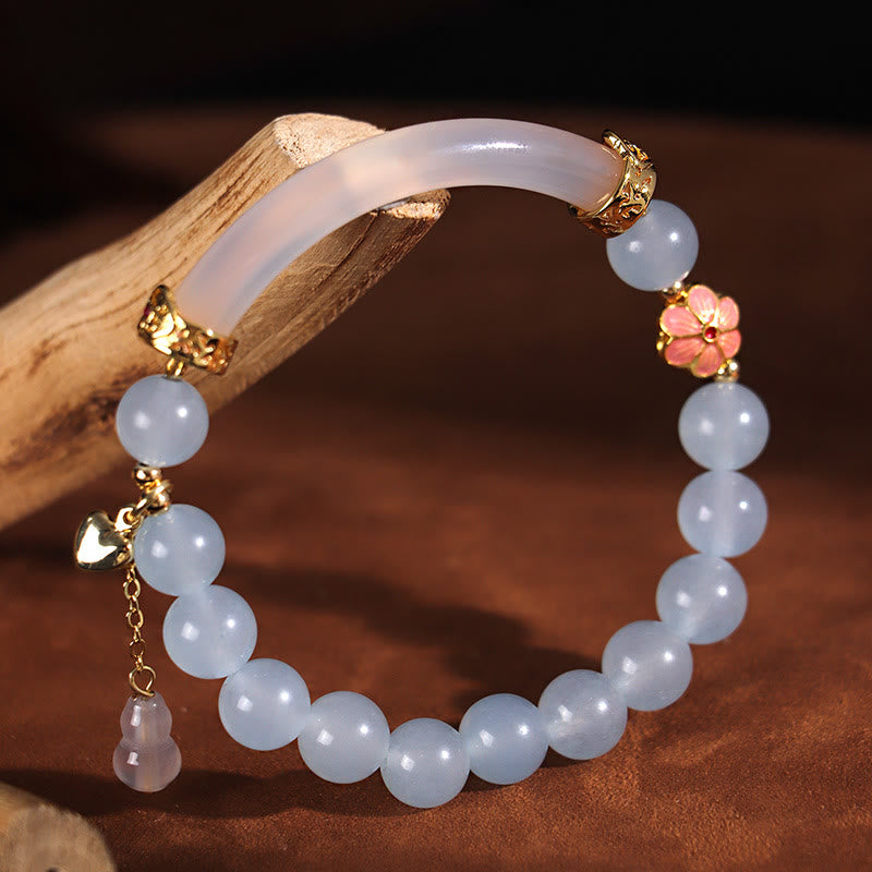 Braccialetto a metà polsino in perle di calcedonio blu e cristallo rosa Buddha Stones