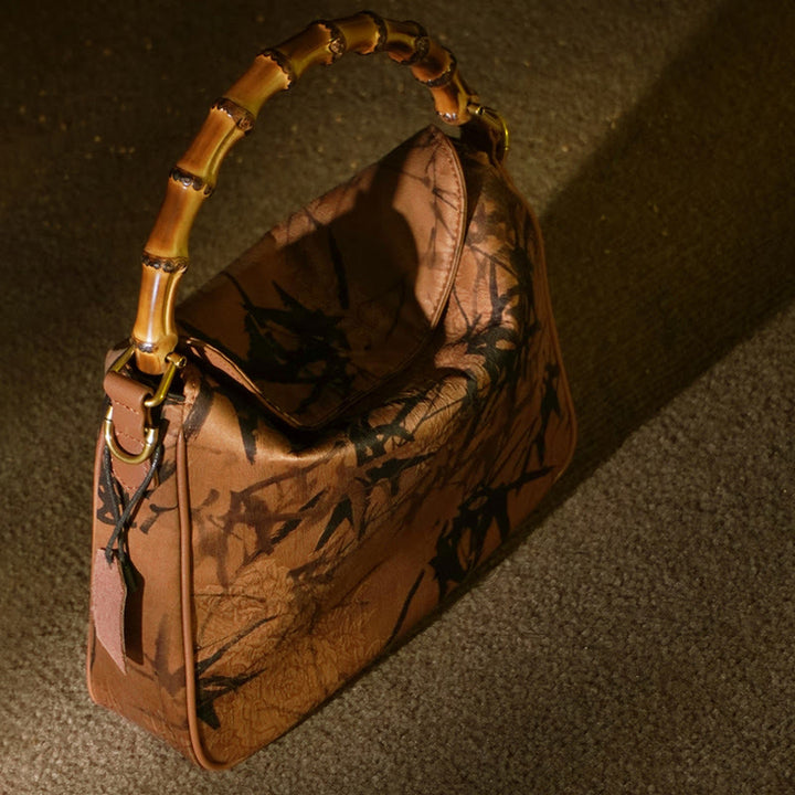 Borsa a tracolla in seta Xiangyunsha con manico in bambù lussureggiante Buddha Stones