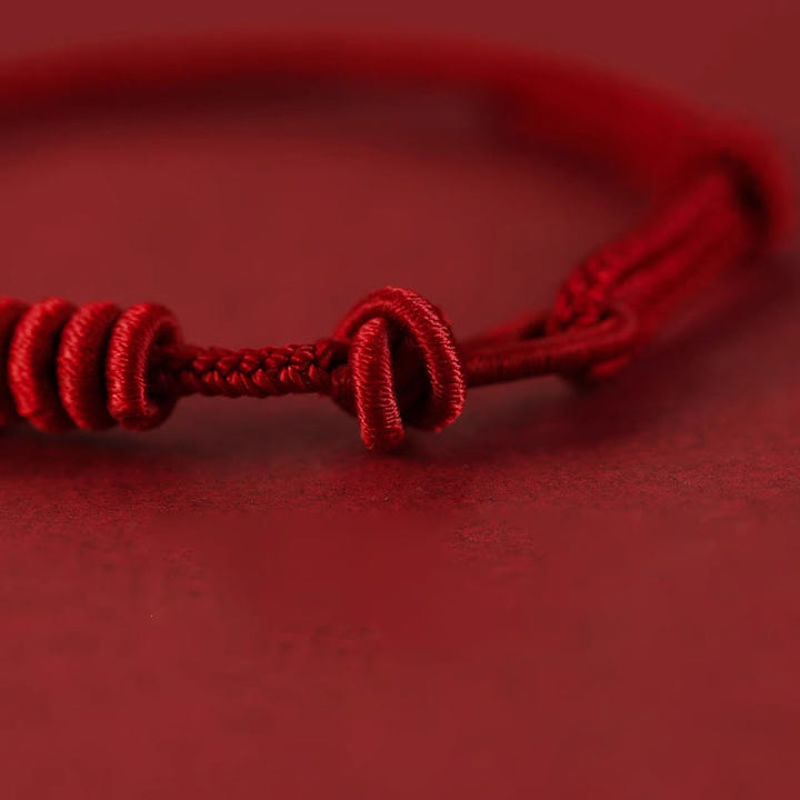 Braccialetto di forza con corda rossa a otto fili Buddha Stones