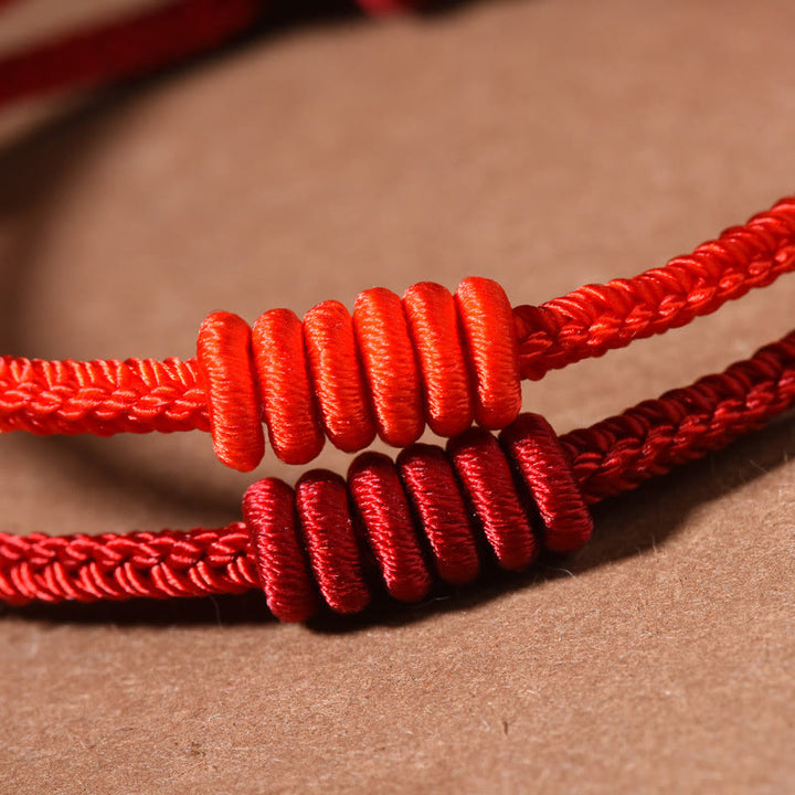 Braccialetto di forza con corda rossa a otto fili Buddha Stones