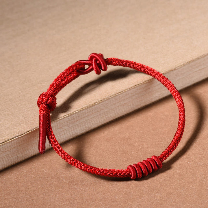 Braccialetto di forza con corda rossa a otto fili Buddha Stones