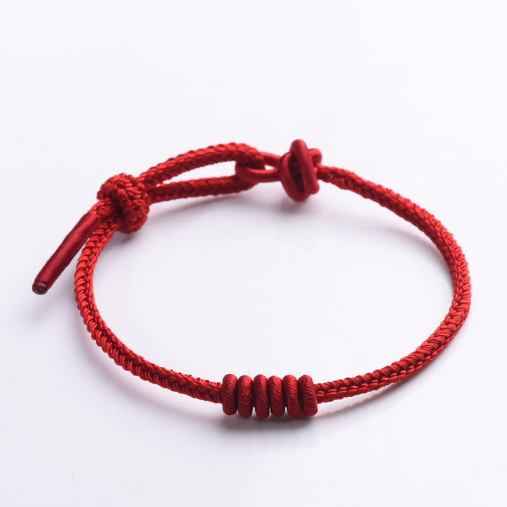 Braccialetto di forza con corda rossa a otto fili Buddha Stones
