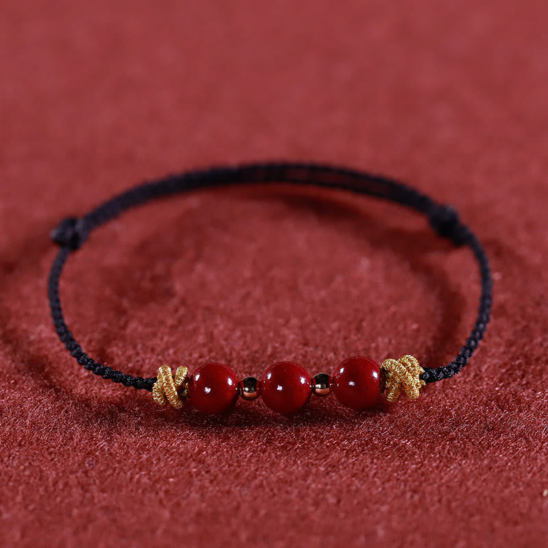 Braccialetto Buddha Stones con corda colorata e cinabro calmo