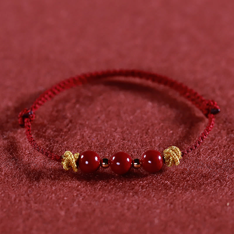 Braccialetto Buddha Stones con corda colorata e cinabro calmo