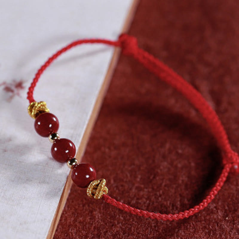 Braccialetto Buddha Stones con corda colorata e cinabro calmo