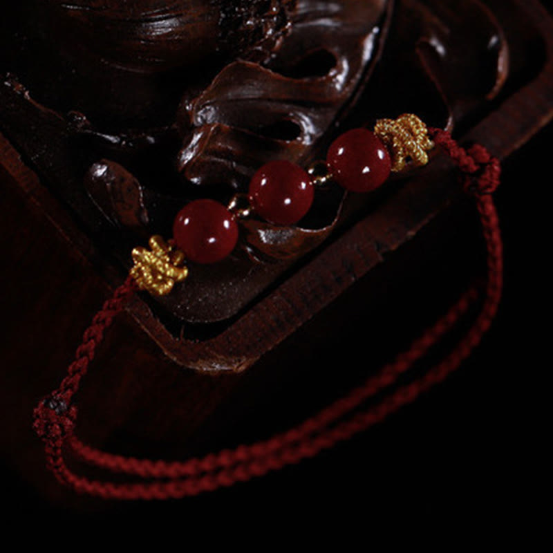 Braccialetto Buddha Stones con corda colorata e cinabro calmo