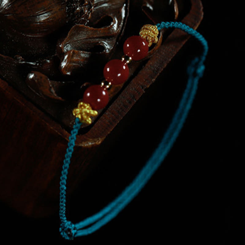 Braccialetto Buddha Stones con corda colorata e cinabro calmo