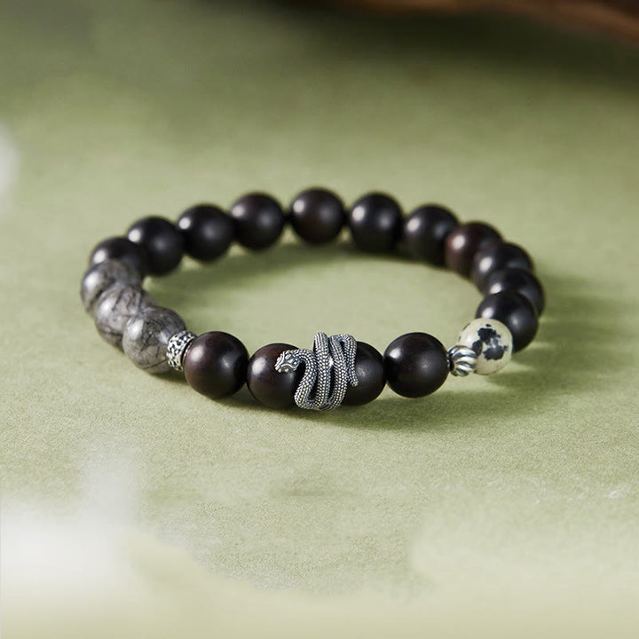 Braccialetto Buddha Stones in legno di ebano, quarzo rutilato nero, argento sterling 925, anno del serpente