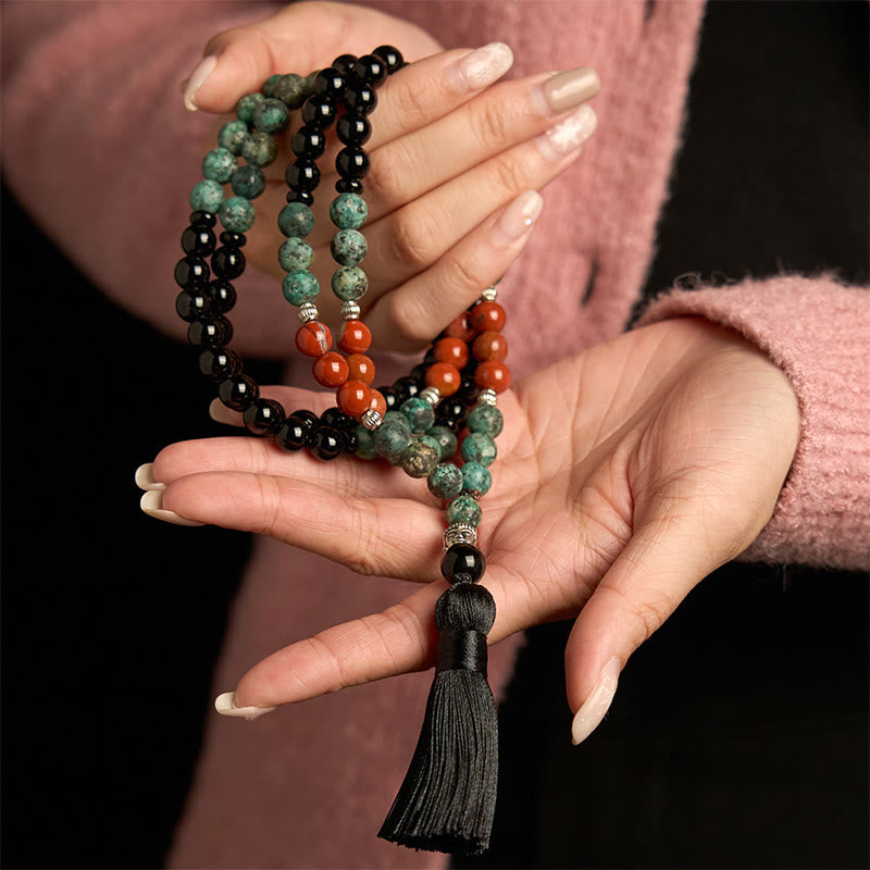 Buddha Stones 108 Mala Onice nero naturale Diaspro rosso Perline turchesi Braccialetto di protezione con nappa a testa di Buddha