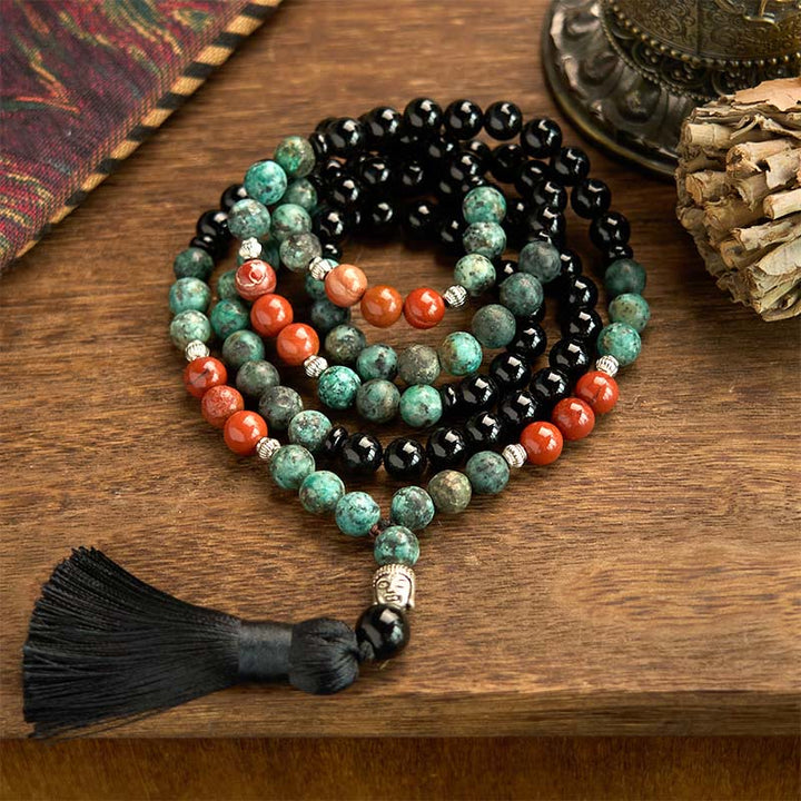 Buddha Stones 108 Mala Onice nero naturale Diaspro rosso Perline turchesi Braccialetto di protezione con nappa a testa di Buddha