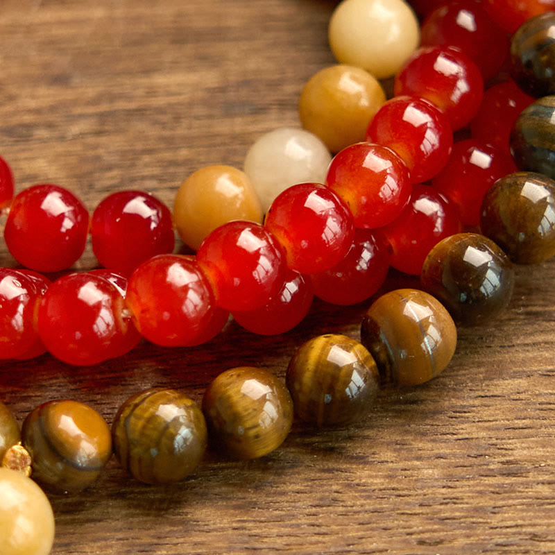 Braccialetto Buddha Stones 108 Mala Beads Agata rossa Occhio di tigre Nappa gialla Calma