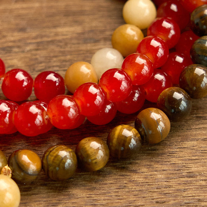 Braccialetto Buddha Stones 108 Mala Beads Agata rossa Occhio di tigre Nappa gialla Calma