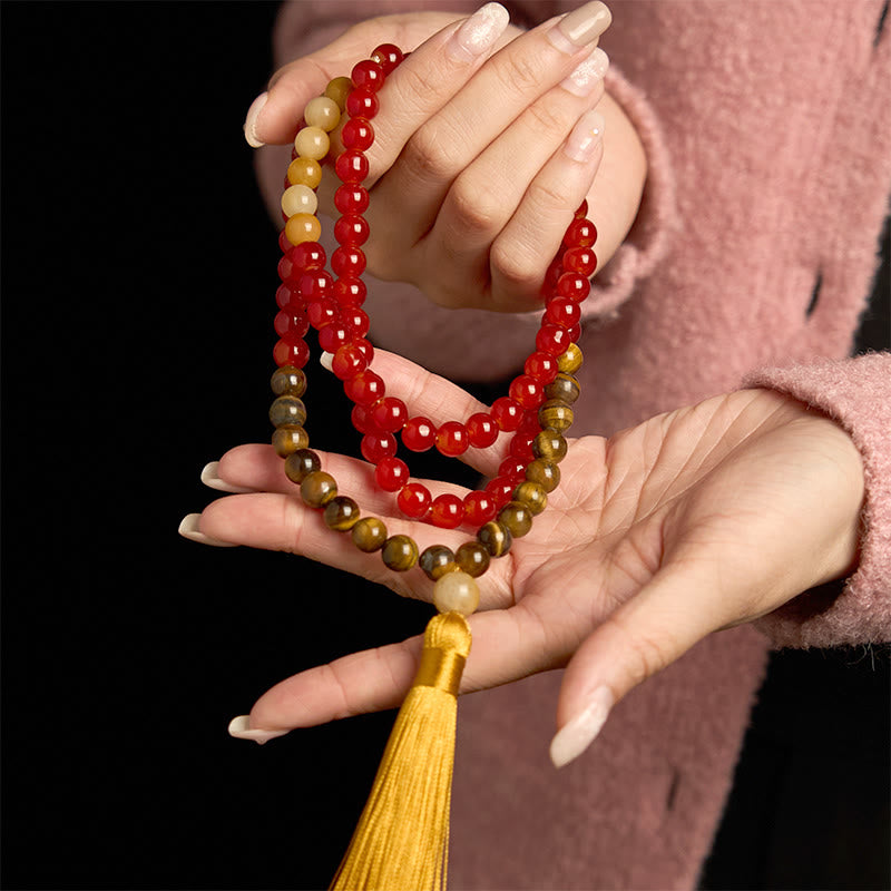 Braccialetto Buddha Stones 108 Mala Beads Agata rossa Occhio di tigre Nappa gialla Calma