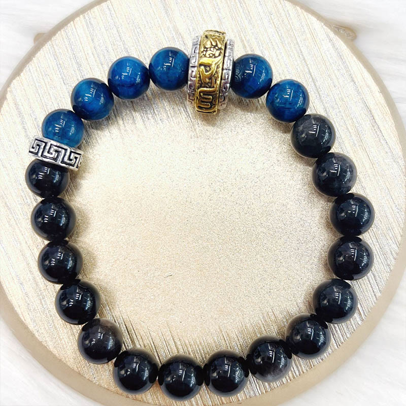 Braccialetto di protezione in occhio di tigre blu ossidiana e argento lucido Buddha Stones