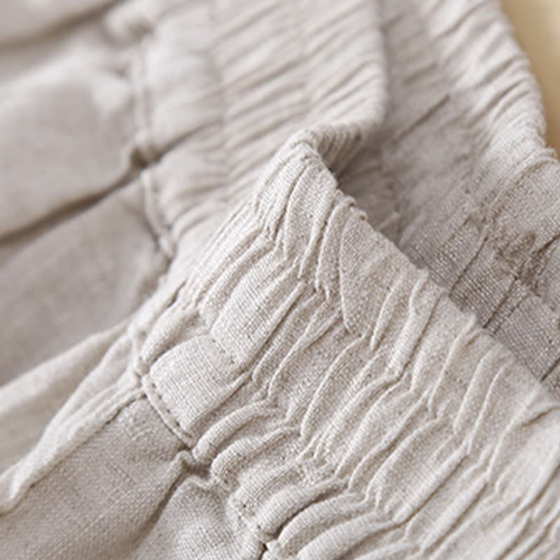 Pantaloni da donna in lino con tasche e ricamo floreale tinta unita Buddha Stones
