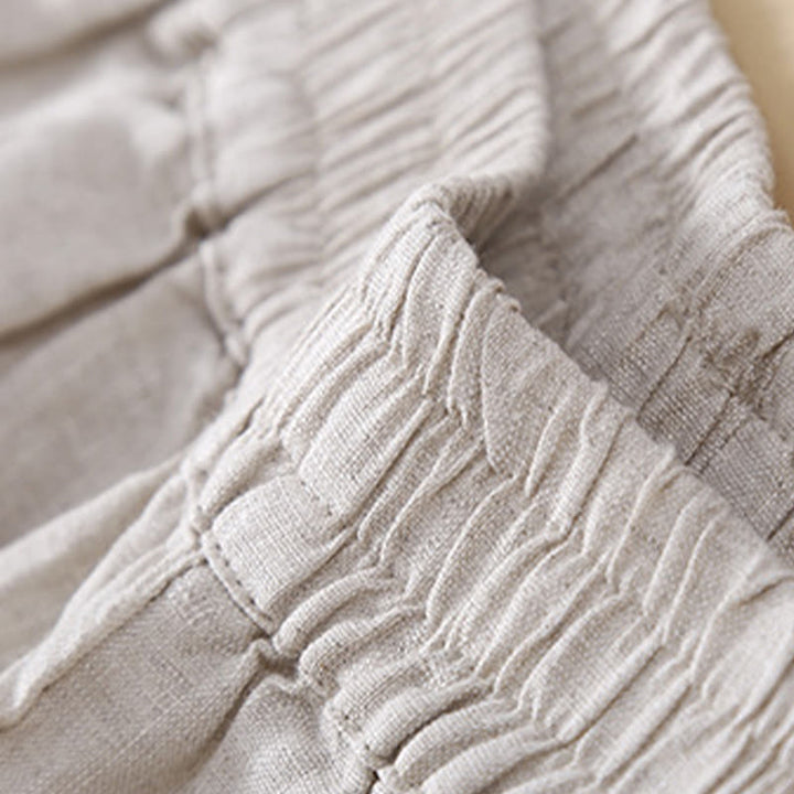 Pantaloni da donna in lino con tasche e ricamo floreale tinta unita Buddha Stones