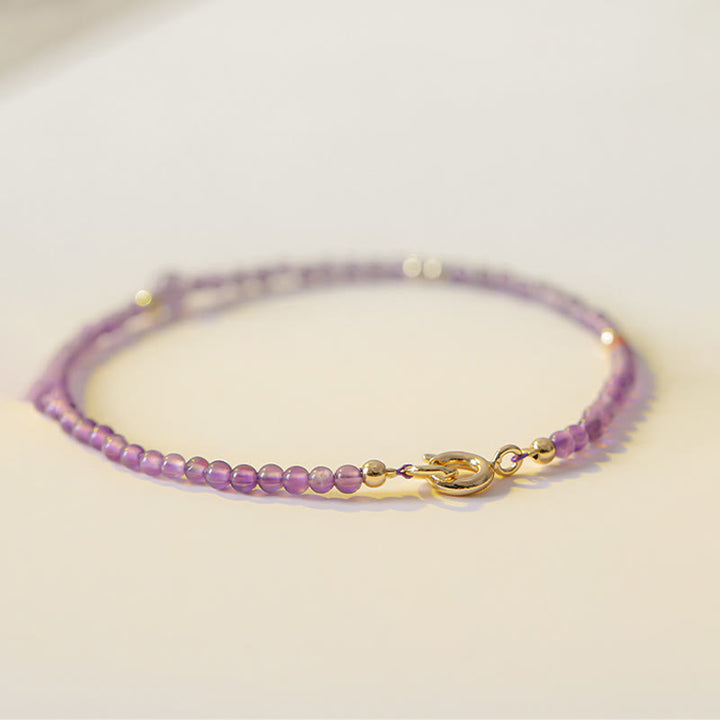Braccialetto di meditazione per la pace interiore in rame placcato oro 14k con perline ultrasottili da 2 mm Buddha Stones Ametista naturale