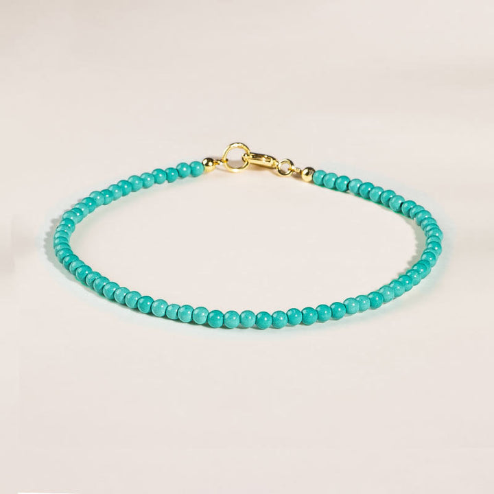 Braccialetto della saggezza in rame placcato oro 14k con perline ultrasottili color turchese da 2 mm Buddha Stones