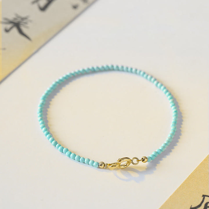 Braccialetto della saggezza in rame placcato oro 14k con perline ultrasottili color turchese da 2 mm Buddha Stones